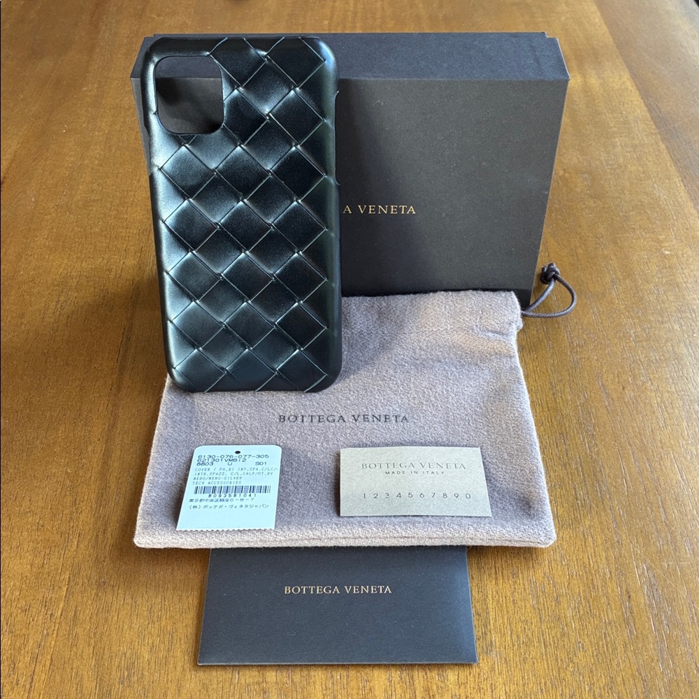 Brand new Bottega Veneta black leather iPhone 11 case.